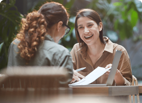 Two smiling people in a casual job interview