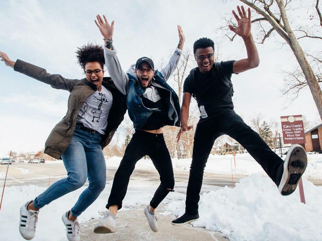 A group of young people jumping in the air
