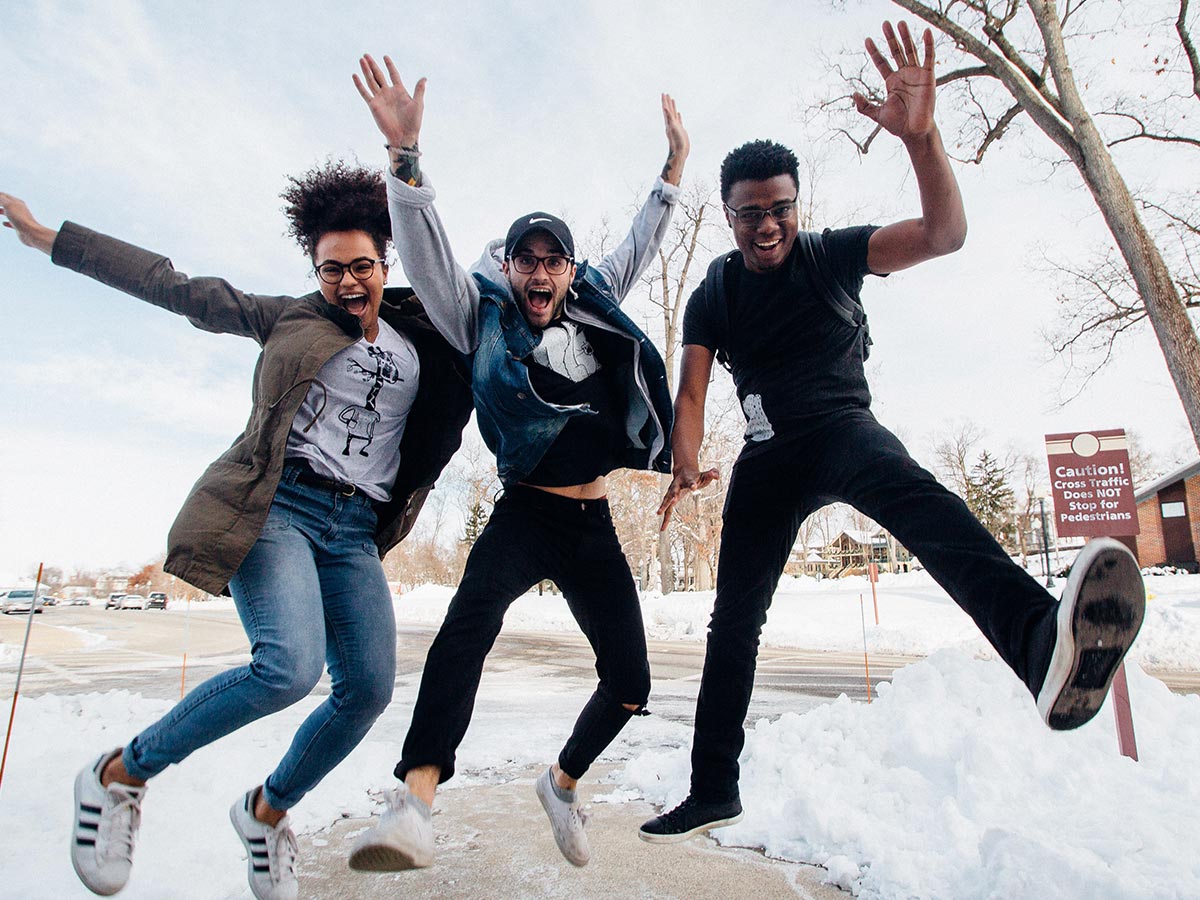 A group of young people jumping in the air